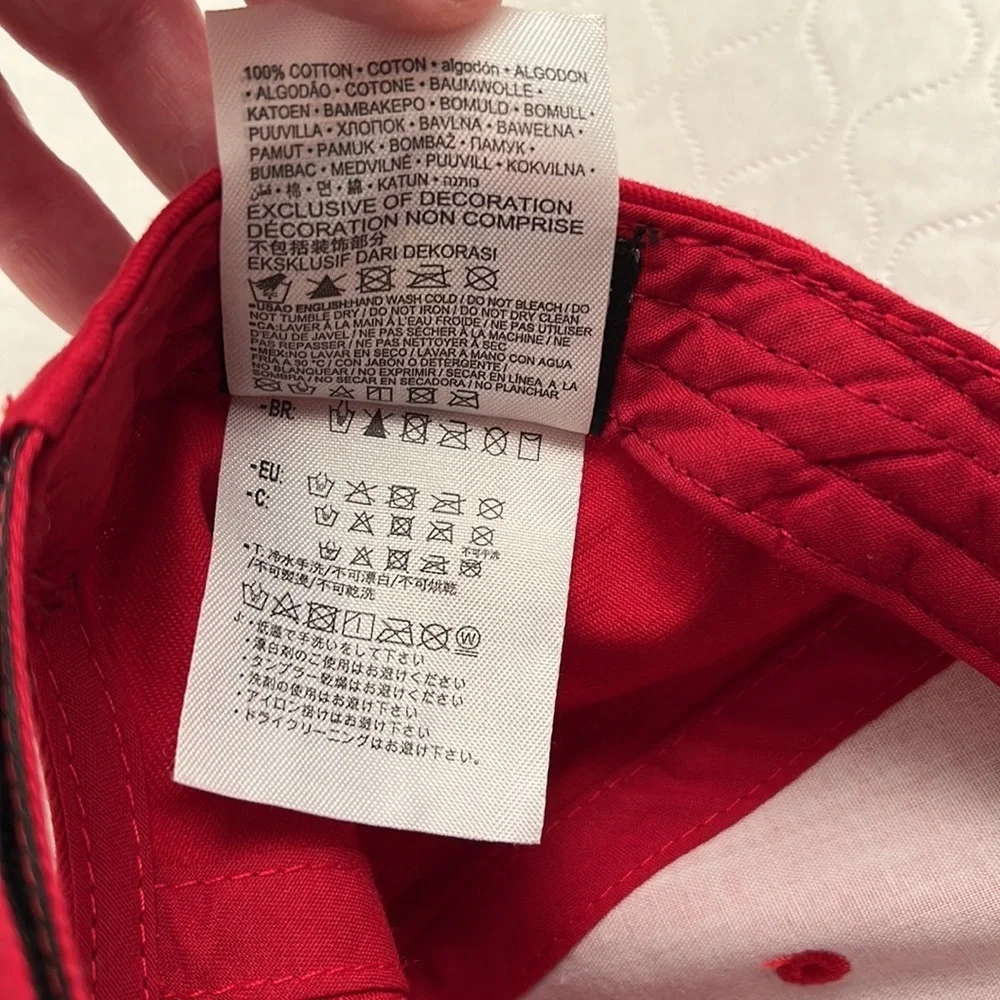 Nike red infant adjustable baseball hat with black swoosh